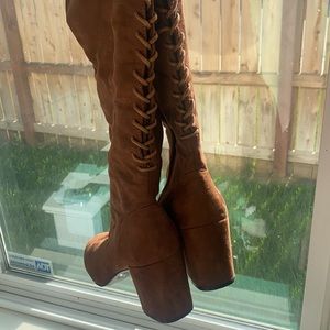 Knee high brown lace up boots